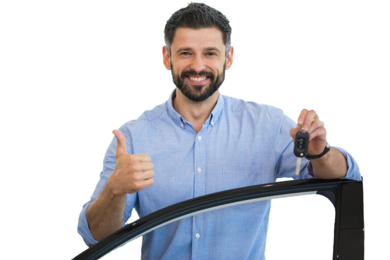 man giving thumbs up sign with keys in hand standing behind new car