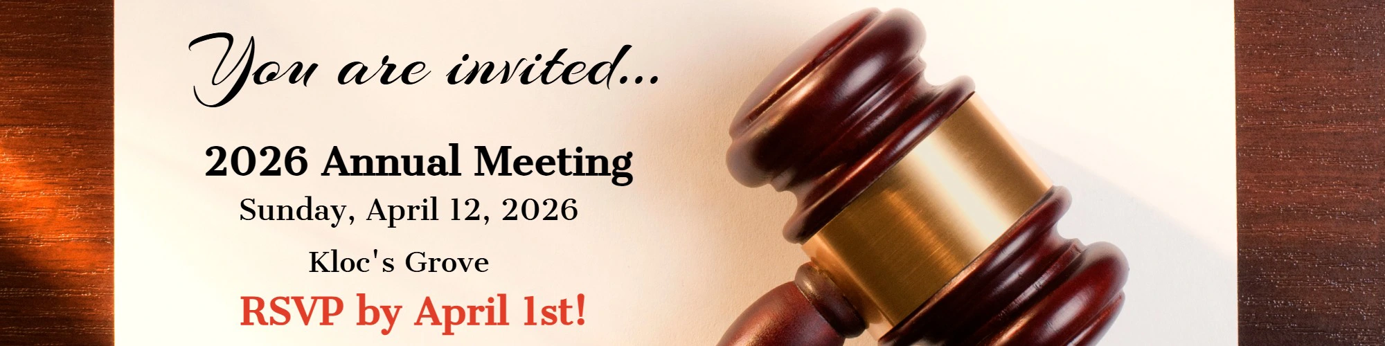 close up of gavel with invitation on desk to CrossRoads Community FCU 2026 Annual Meeting April 12, 2026