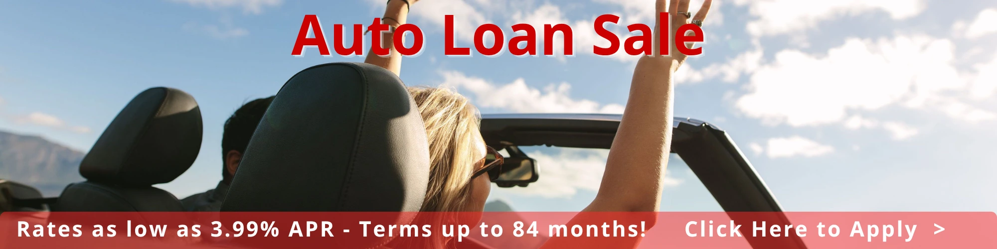 Woman in convertible with hands in the air. 3.99% Auto Rates