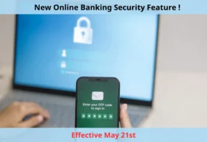 Hand holding mobile phone with otp security code with laptop in background to sign online