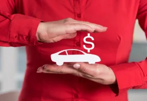 close up of persons hands parallel to each other with a graphic of dollar sign and car to represent insurance protection