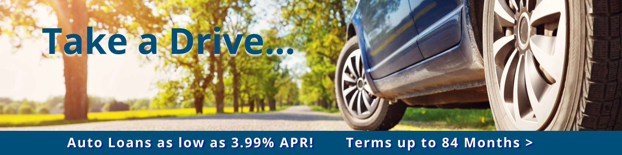 worms eye view of car on road promoting auto loans as low as 3.99%apr.