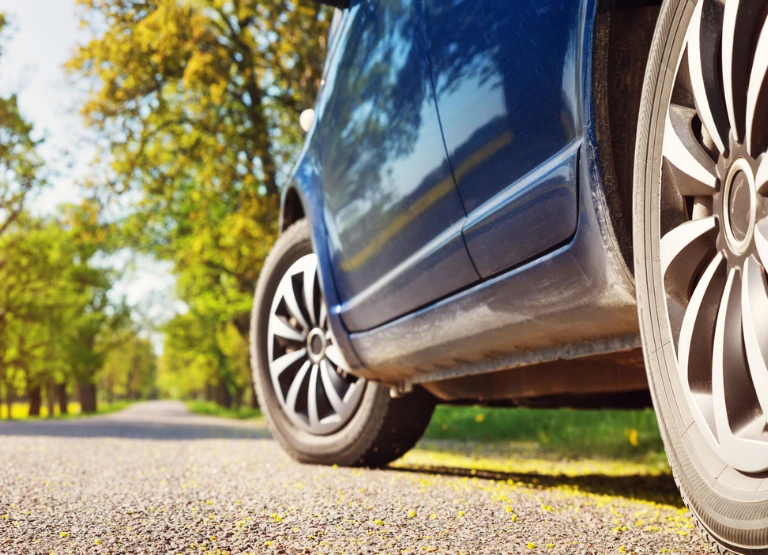 worms eye view of car on road promoting auto loans as low as 3.99%apr