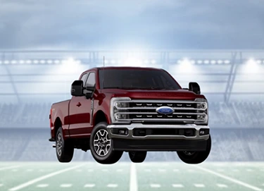 Red truck on football field