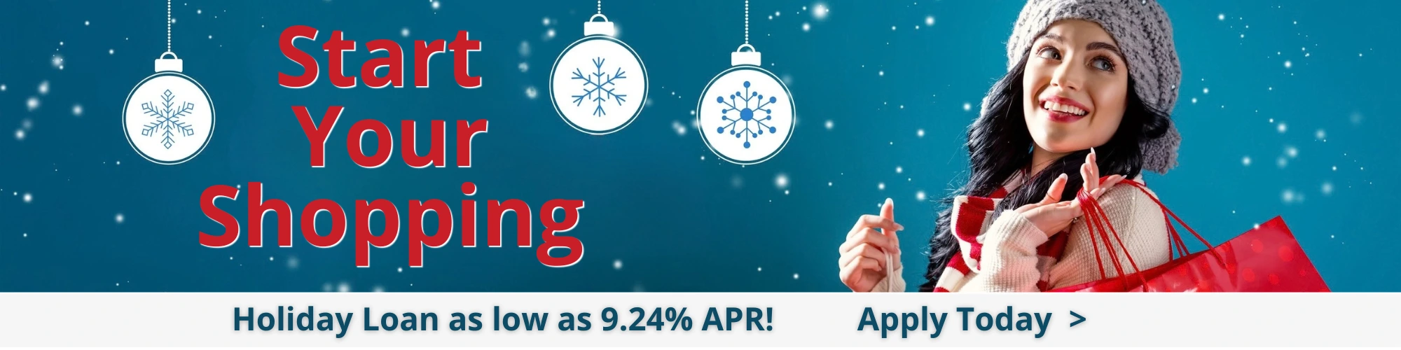 Woman wearing winter hat holiday shopping, snow in background Holiday Loan rates 9.24% apr